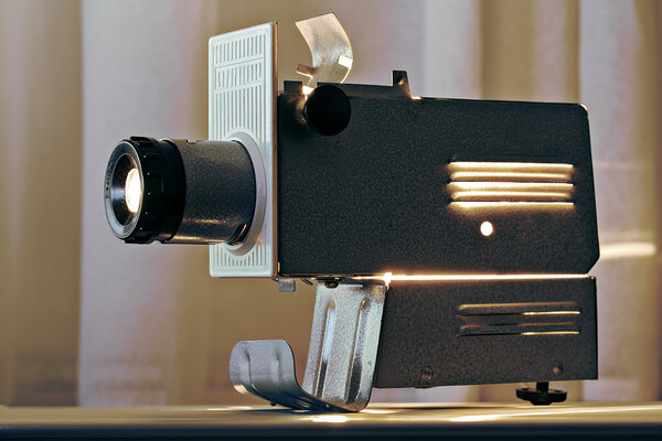 Working projector on table top radiating heat