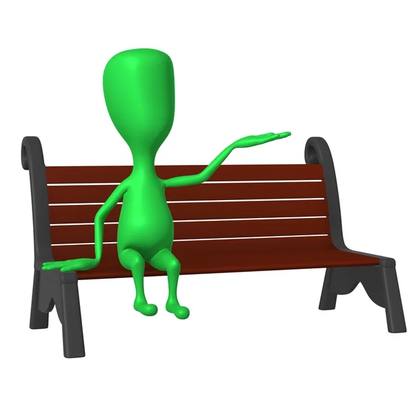 View green puppet on bench testing weather — Stock Photo, Image