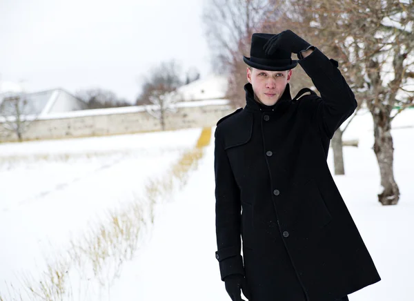 Young man put hat back — Stock Photo, Image