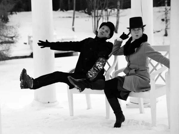 Shaded man and woman worming at chairs — Stock Photo, Image