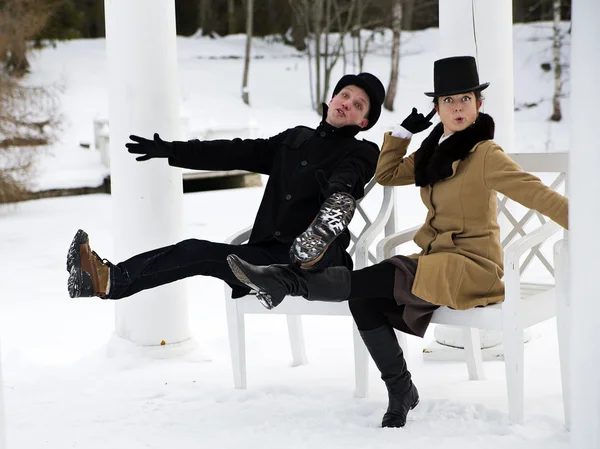 Man and woman worming at balcony chairs — Stock Photo, Image