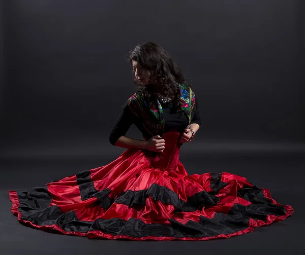 Young woman stretches back in spanish traditional clothes — Stock Photo, Image