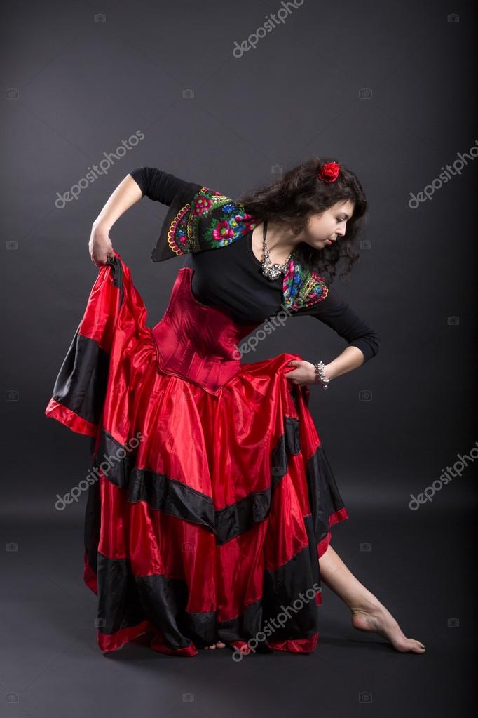 Young woman make step in spanish traditional clothes Stock Photo