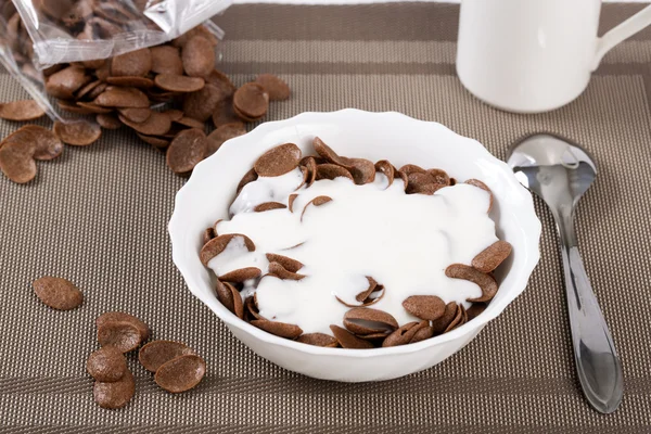 Flakes in bowl sinking in sour cream Stock Picture
