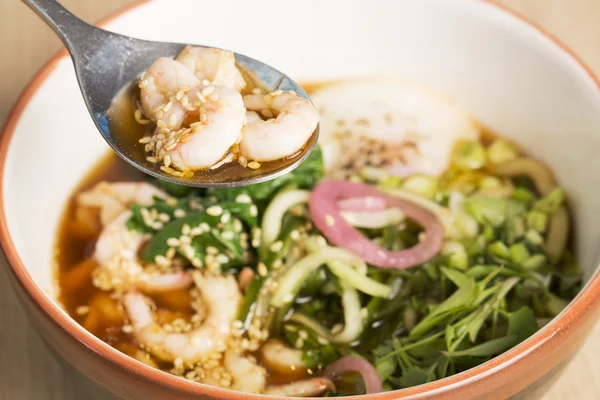 Bowl with broth, shrimp and fesh parsley — Stock Photo, Image