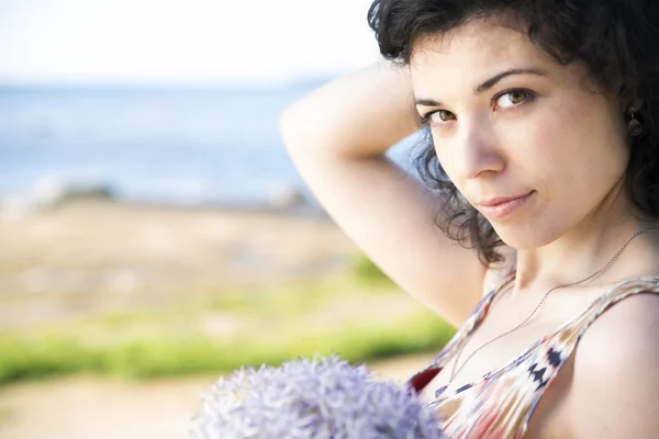 Focus of woman with dark hairs — Stock Photo, Image