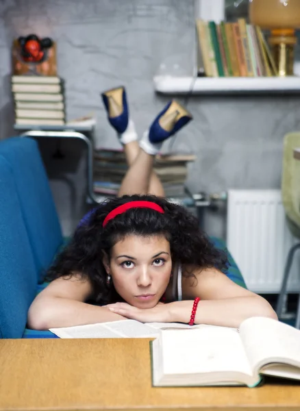 Young woman lay on sofa and thinking — Stock Photo, Image