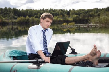 Dressed man in boat and reading clipart