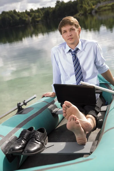 Dressed man in boat rest — Stock Photo, Image