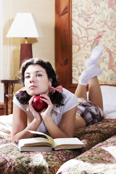 Woman in schoolgirl dress hold apple — Stock Photo, Image