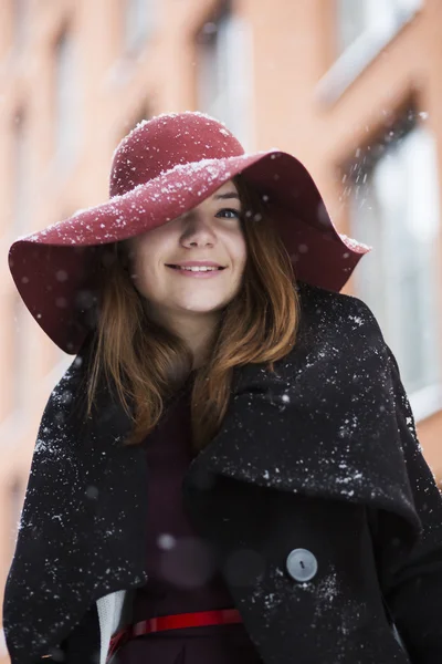 Hat hide woman eye under light snowfall — Stock Photo, Image