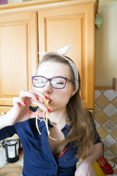 Woman at sexy suit eat many noodles — Stock Photo, Image