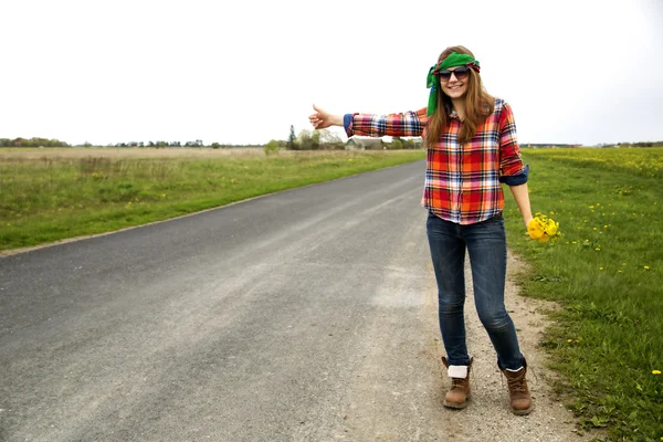 Woman vote on road with finger up — Stock Photo, Image