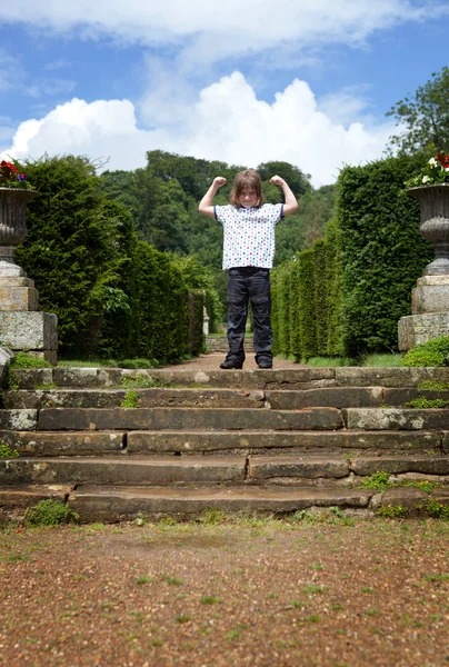 Child park steps arms raised — Stock Photo, Image