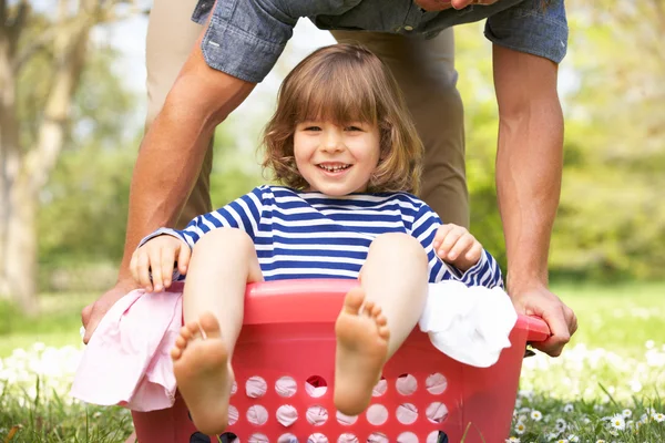 Father Carrying Son Sitting In Laundry Basket — Stock Photo, Image