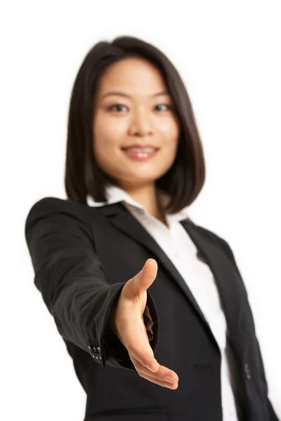 Studio Portrait Of Chinese Businesswoman Reaching Out To Shake H — Stock Photo, Image