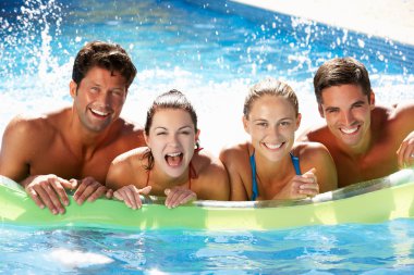 Group Of Friends Having Fun In Swimming Pool clipart