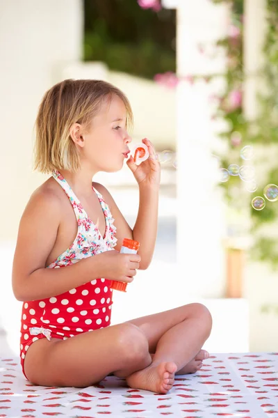 Girl Wearing Swimming Costume Blowing Bubbles — Stock Photo, Image