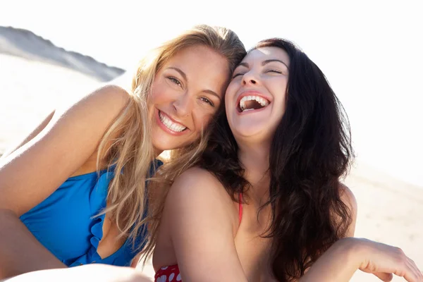 Two Women Enjoying Beach Holiday Stock Photo