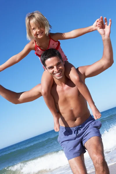 Father And Daughter Having Fun On Beach Royalty Free Stock Images
