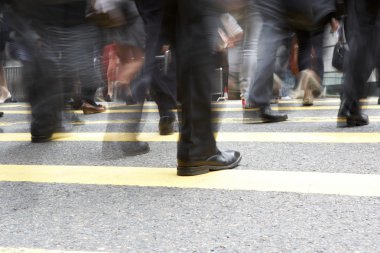 Close Up Of Commuters Feet Crossing Busy Hong Kong Street clipart