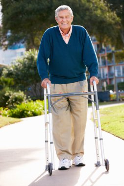 Senior Man With Walking Frame clipart