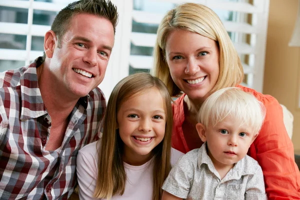 Portrait Of Family Sitting On Sofa At Home — Stock Photo, Image