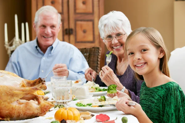 Granddaughter Celebrating Thanksgiving With Grandparents Royalty Free Stock Photos