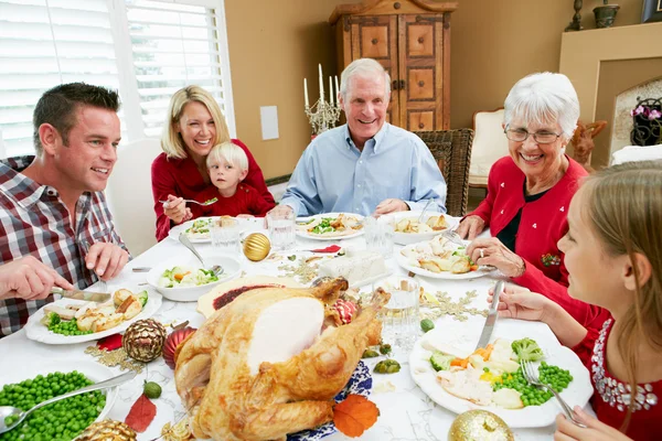 Multi Generation Family Celebrating With Christmas Meal Stock Image