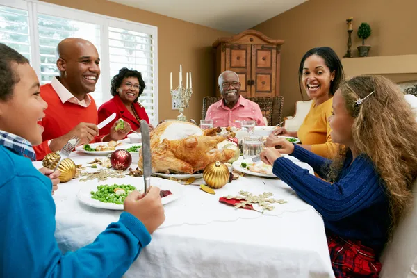 Multi Generation Family Celebrating With Christmas Meal Stock Photo