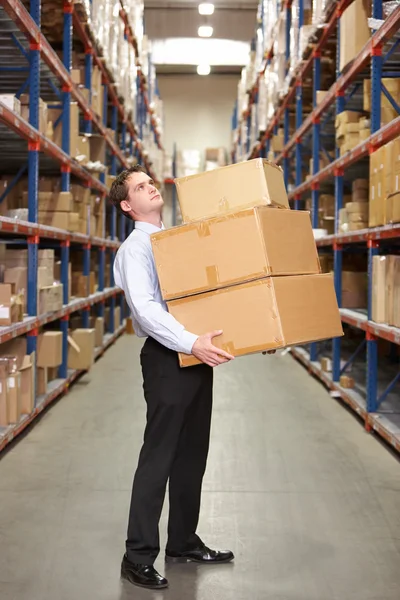 Man Carrying Boxes In Warehouse — Stok fotoğraf