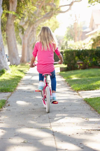 Girl Riding Bike Along Path — Stockfoto
