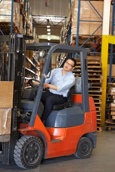 Man Driving Fork Lift Truck In Warehouse — Stock Photo, Image