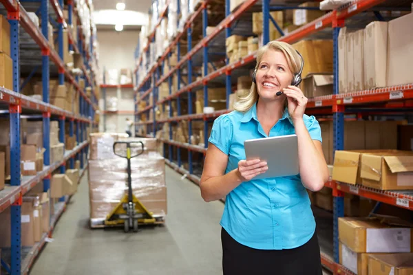 Businesswoman Using Digital Tablet In Distribution Warehouse — Stock Photo, Image