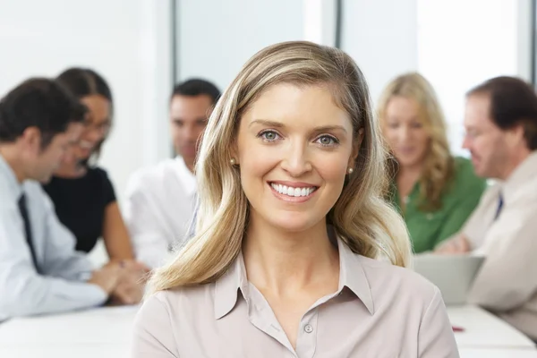 Portrait Of Businesswoman Sitting At Boardroom Table — Stock Photo, Image