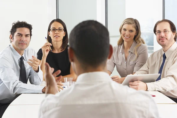 View From Behind As CEO Addresses Meeting In Boardroom — Stock Photo, Image