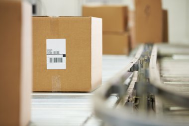 Goods On Conveyor Belt In Distribution Warehouse clipart