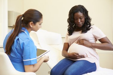 Pregnant Check By Nurse clipart