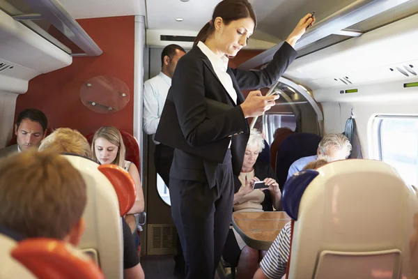 Businesswoman texting message on mobile phone — Stock Photo, Image