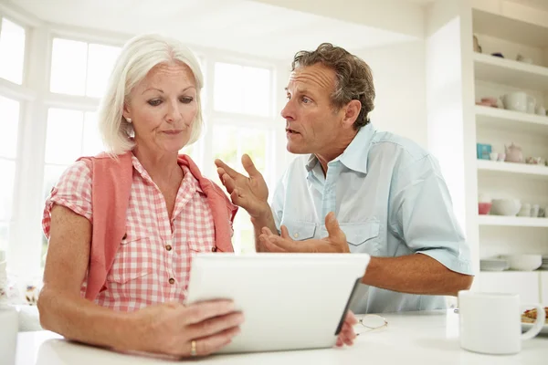 Middle Aged Couple Looking At Digital Tablet — Stock Photo, Image