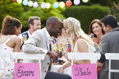 Bride And Groom Enjoying Meal clipart