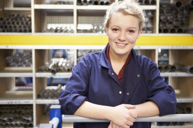 Female Engineering Apprentice In Store Room clipart