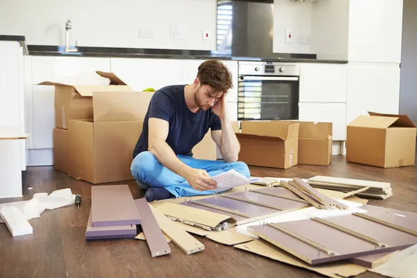Man Putting Together Assembly Furniture — Stock Image Man Putting Together Assembly Furniture Royalty Free Stock Photos