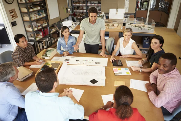 Group Of Architects Sitting Around Table Having Meeting — Stock Photo, Image