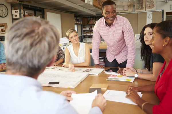 Male Boss Leading Meeting Of Architects Sitting At Table — Stock Photo, Image