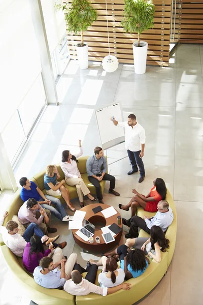 Businessman Making Presentation To Office Colleagues — Stock Photo, Image