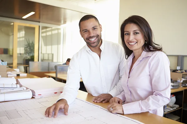 Architects Studying Plans In Modern Office Together — Stock Photo, Image
