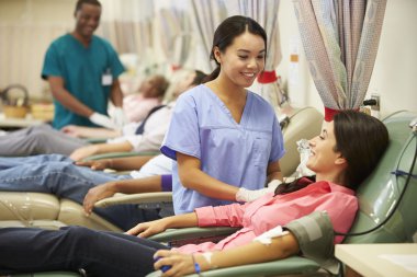 Blood Donors Making Donation In Hospital clipart