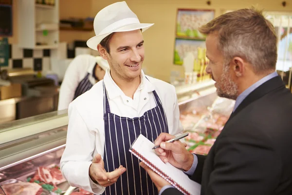 Bank Manager Meeting With Owner Of Butchers Shop — Stock Photo, Image