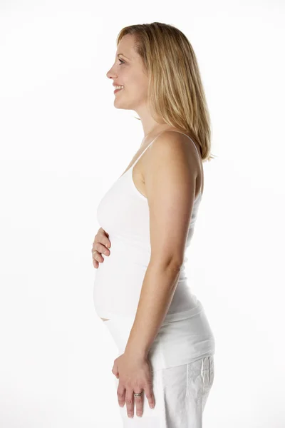Kobieta w ciąży sobie biały — Zdjęcie stockowe